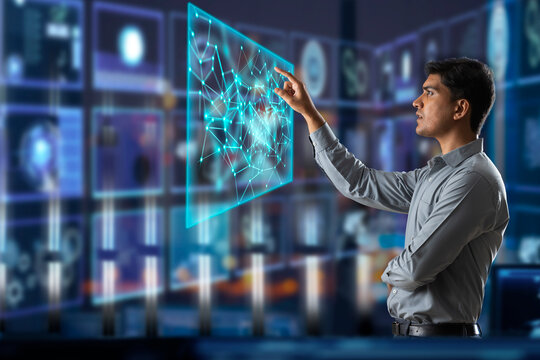 Digitally enhanced shot of a  technician/businessman working with virtual reality projection