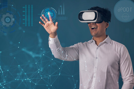  Man wearing VR headset and pointing at digital Screen 