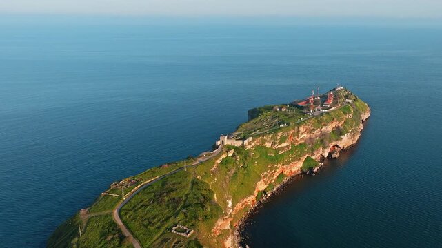 Medieval fortress ruins on Cape Kaliakra rocky headland narrow peninsula pathway aerial drone view scenic Black Sea coast Kavarna Dobrich Province Bulgaria summer travel concept.