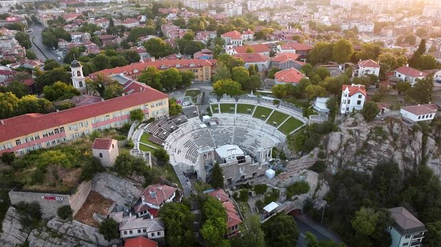 Ancient Roman Theatre of Philippopolis in Plovdiv Old Town historical amphitheater ruins aerial drone view summer evening travel tourism background Bulgaria.