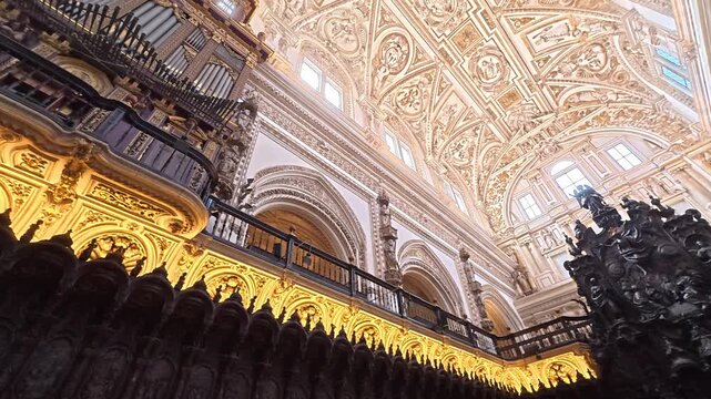 Step into a world of architectural wonder as you gaze at the stunning arches and red-and-white patterns inside the Great Mosque of Cordoba. Light filters through, illuminating the beauty.