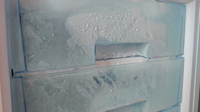 Defrosting a freezer with ice buildup takes time and careful steps