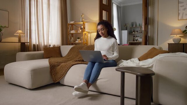 Young Woman Working on Laptop at Home