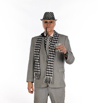 Male businessman with a pipe in a gray suit isolated on white background