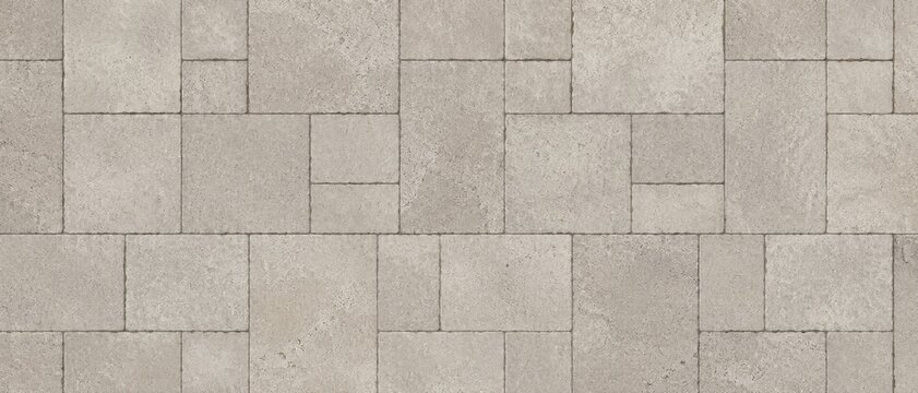 Overhead view of beige rectangular concrete pavers arranged in an interlocking geometric pattern across paved patio or walkway surface with textured finish and visible grout lines
