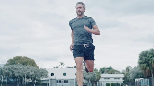 Adult man running. Sportsman jogger running. Man sportsman running for exercise. Sport athlete man run. Runner at stadium sport run. Sportsman runner running outdoor. Sport run footage