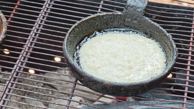 How to cook draniki, traditional potato pancakes in a frying pan outdoors
