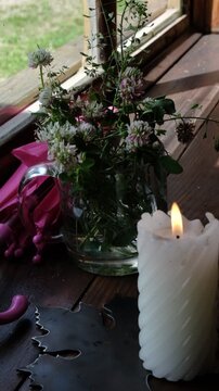 Candlelight in the dark, flowers in the cup, old house, village weekend coming to an end, atmospheric mood. Cozy, comforting, yet tinged with gentle sadness of saying goodbye to peaceful interlude.