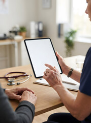 Fototapeta premium Nurse Showing Blank Digital Tablet Screen to Patient During Healthcare Consultation