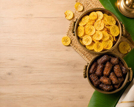 Premium Kerala Banana Chips and Sharkara Upperi Background with Rustic Wooden Copy Space