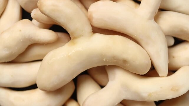 A pile of fresh peeled White Turmeric slowly rotating, Top view shot