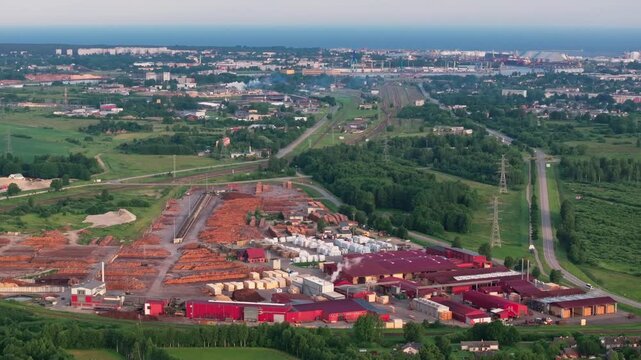 Aerial view of timber processing facility with railway and Ventspils Port in Latvia