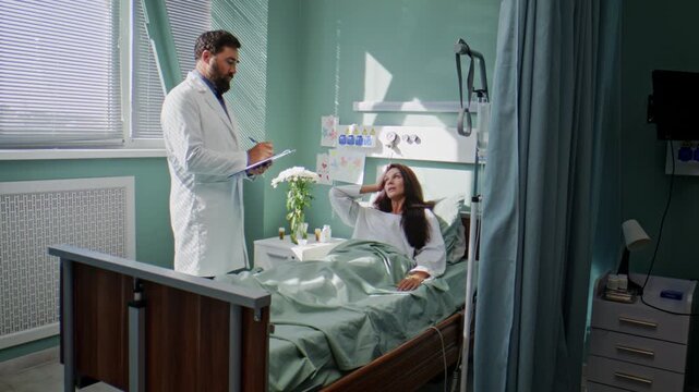 Doctor listens to woman complains on headache and stomachache