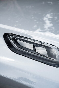 Silver Land Rover Range Rover Sport hood vent lettering close up, Luxury SUV exterior bading details