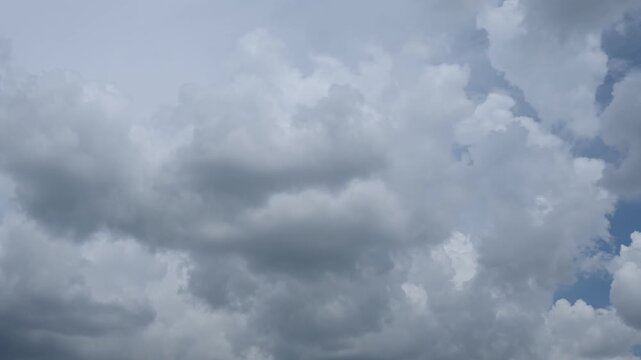 cinematic time lapse video of gray rain clouds condensing in the sky during an oncoming storm