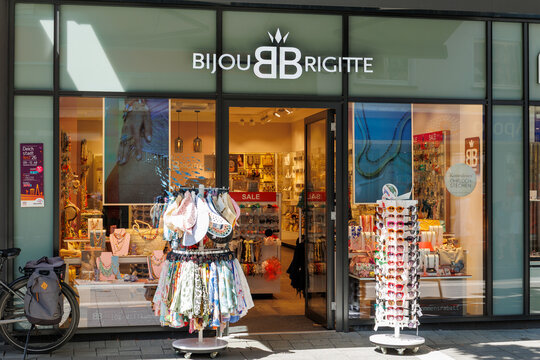 Neuwied, Germany - July 13, 2026: Bijou Brigitte retail store showing its wide selection of jewelry, fashion accessories, sunglasses and scarves displayed in the storefront window and on outdoor racks