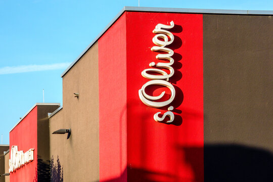 Mulheim Karlich, Germany - July 13, 2026: S.Oliver brand logo and name on a building, representing fashion, retail, and shopping on a bright sunny day with blue sky