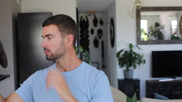 Handsome man looking at the mirror 
