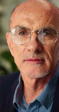 Business, face and mature man in office with glasses for finance agency, investment and about us. Corporate, broker and portrait of person for management, advisor and serious for financial company