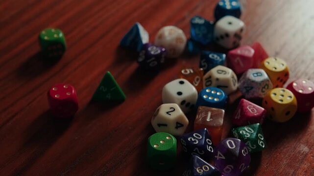Colorful Polyhedral Gaming Dice Collection on a Wooden Table