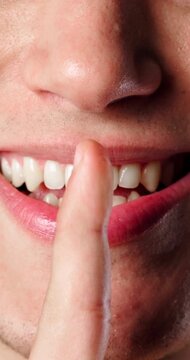 Person, hands and lips with secret for mischief plan, whisper or conspiracy scheme for malicious plot. Closeup, mouth and smile with sneaky expression for silence, quiet or mysterious vendetta