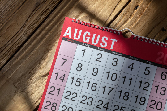 Calendar months and dates on wooden background overhead view