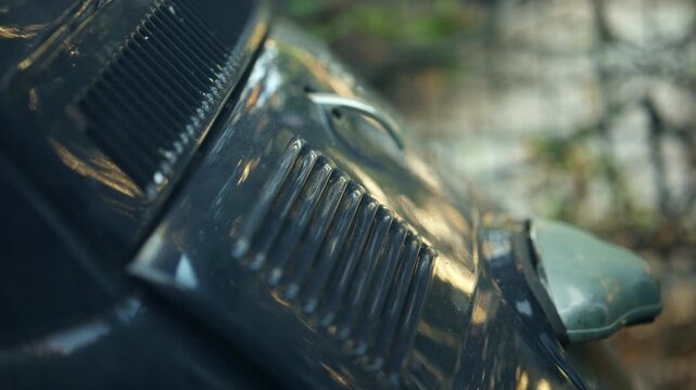 Close up of the rear vents and bodywork of a black vintage automobile