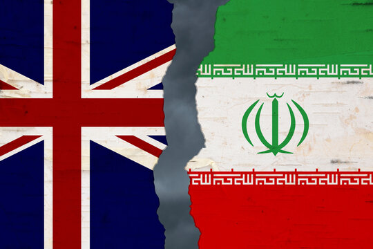 British and Iran flags that are torn apart