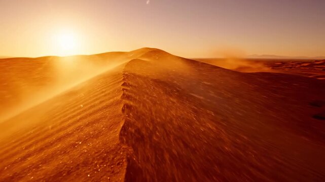 Golden sand dunes shift under the sun in a desert landscape during sunset