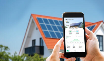Obraz premium Eco friendly lifestyle. Man monitoring sustainable green electricity production from rooftop solar cells via digital dashboard on phone.