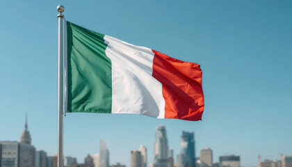 Italian flag waves in a bright blue sky. City skyline stands softly blurred in background. Vibrant green, white, and red colors show bold national pride. Ideal for global events, cultural projects