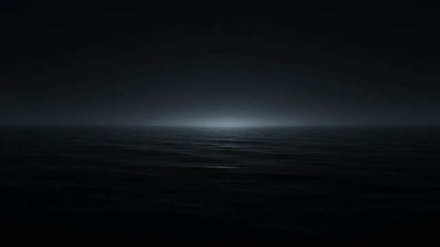 Dark ocean waves gently ripple under a subtle distant light on the serene horizon