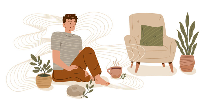Grounding technique anxiety calming mindfulness relaxation peaceful man sitting on floor with plants armchair cup of tea cozy home