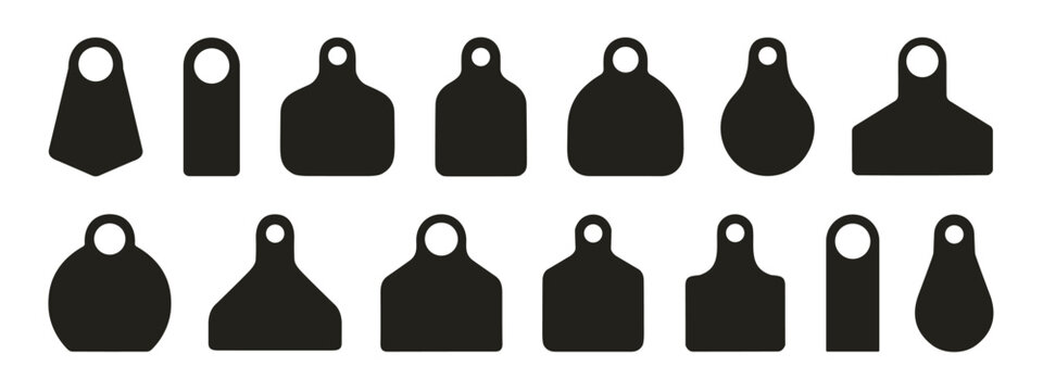 Various ear tags for livestock identification and management purposes on white background  many different shapes and sizes are shown