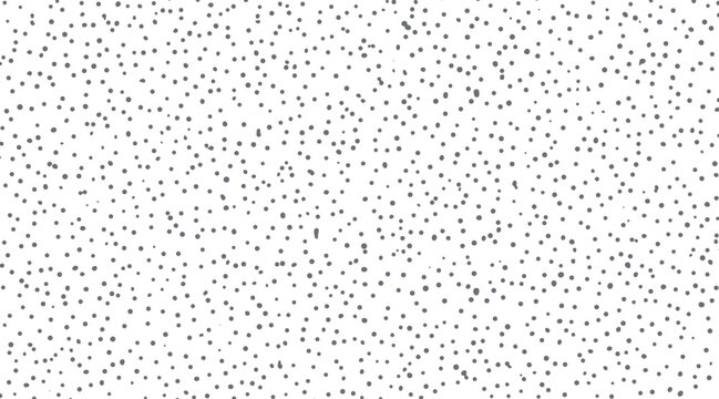 Randomly scattered small gray dots on a white background texture pattern