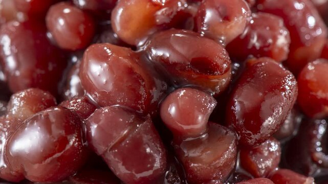 Premium Hokkaido Tokachi azuki beans with glossy moisture droplets, detailed food product photography