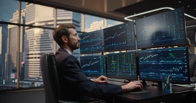 Stock Exchange Broker Types Trading Commands at monitoring Desk, Betting on Price Charts, Market Indicators, Portfolio Analytics for Capital Growth in Corporate Finance Office