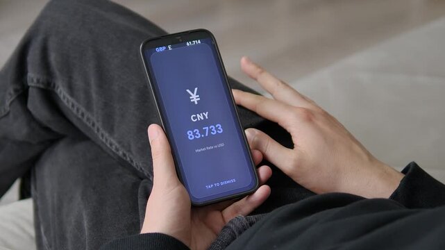 Mobile currency app showing the live CNY to USD market rate. A sleek full screen display of the Chinese Yuan exchange value. Perfect for Asian market traders, import,export businesses, and global fina