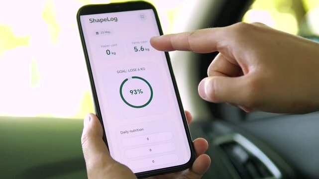 User pointing at a 93 percent completion ring on a weight loss dashboard. The green progress bar shows near-milestone achievement. Ideal for fitness motivation, goal tracking, and health data