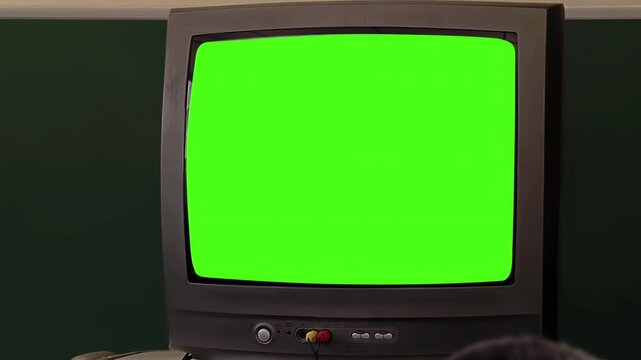 Slow Zoom In on Retro Television with Chroma Key in School Classroom - 4K