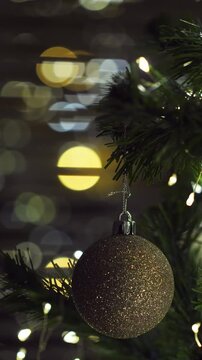 Christmas spruce tree decorated with balls and toys. New Year. Vertical footage