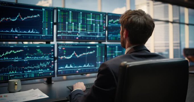 Camera Glides Around a Stock Exchange Asset Management Firm as a Successful Stockbroker Ceo Studies Market Screens, Thinking Strategy, Banking Decisions and Capital Growth for Corporate Career Success