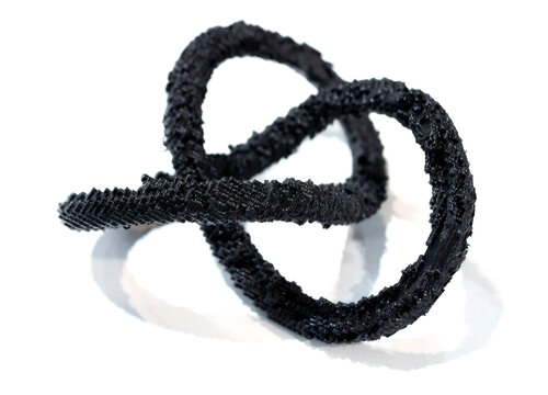 3D printed model of infinity loop. Voxel art style. Model created using photopolymer resin. Object printed on 3D printer from liquid resin isolated on white background SLA technology Stereolithography