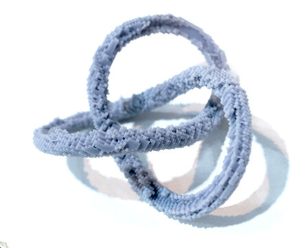 3D printed model of infinity loop. Voxel art style. Model created using photopolymer resin. Object printed on 3D printer from liquid resin isolated on white background SLA technology Stereolithography