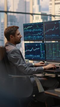 Vertical Screen. Portrait of  Male Broker Analyzes Stock Market Data and Financial Charts at Office Desk, Monitoring Investment Trends and Trading Analytics for Portfolio Growth and Wealth Strategy.