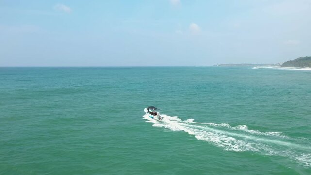 Cinematic Drone Shot of Boat Leaving Polhena Beach, Sri Lanka