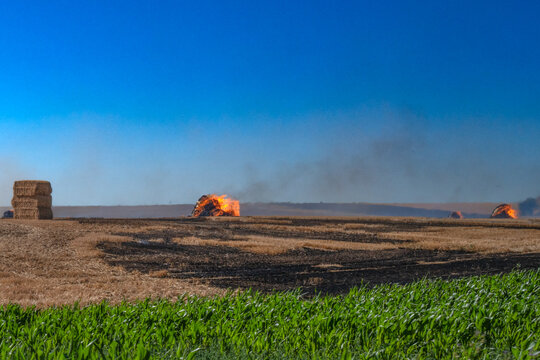 Distant crop fires visible on horizon, agricultural smoke pollution