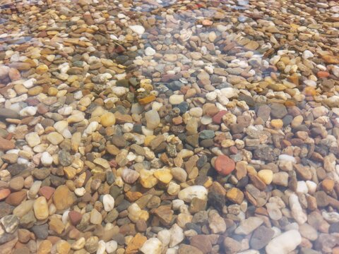 Sea stones, clear sea water close up photo