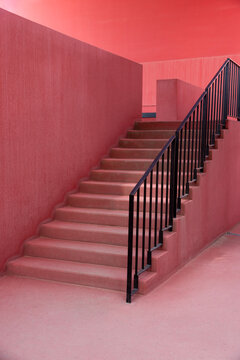 Black metal staircase in a red building