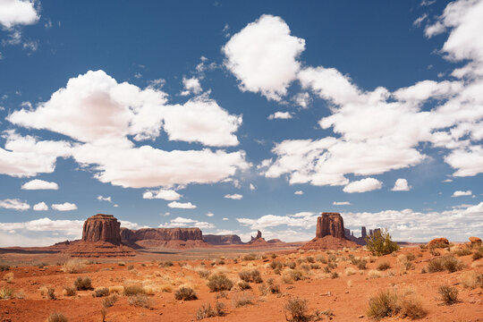 Blue skies with clouds above rock formations in Monument Valley, Arizona